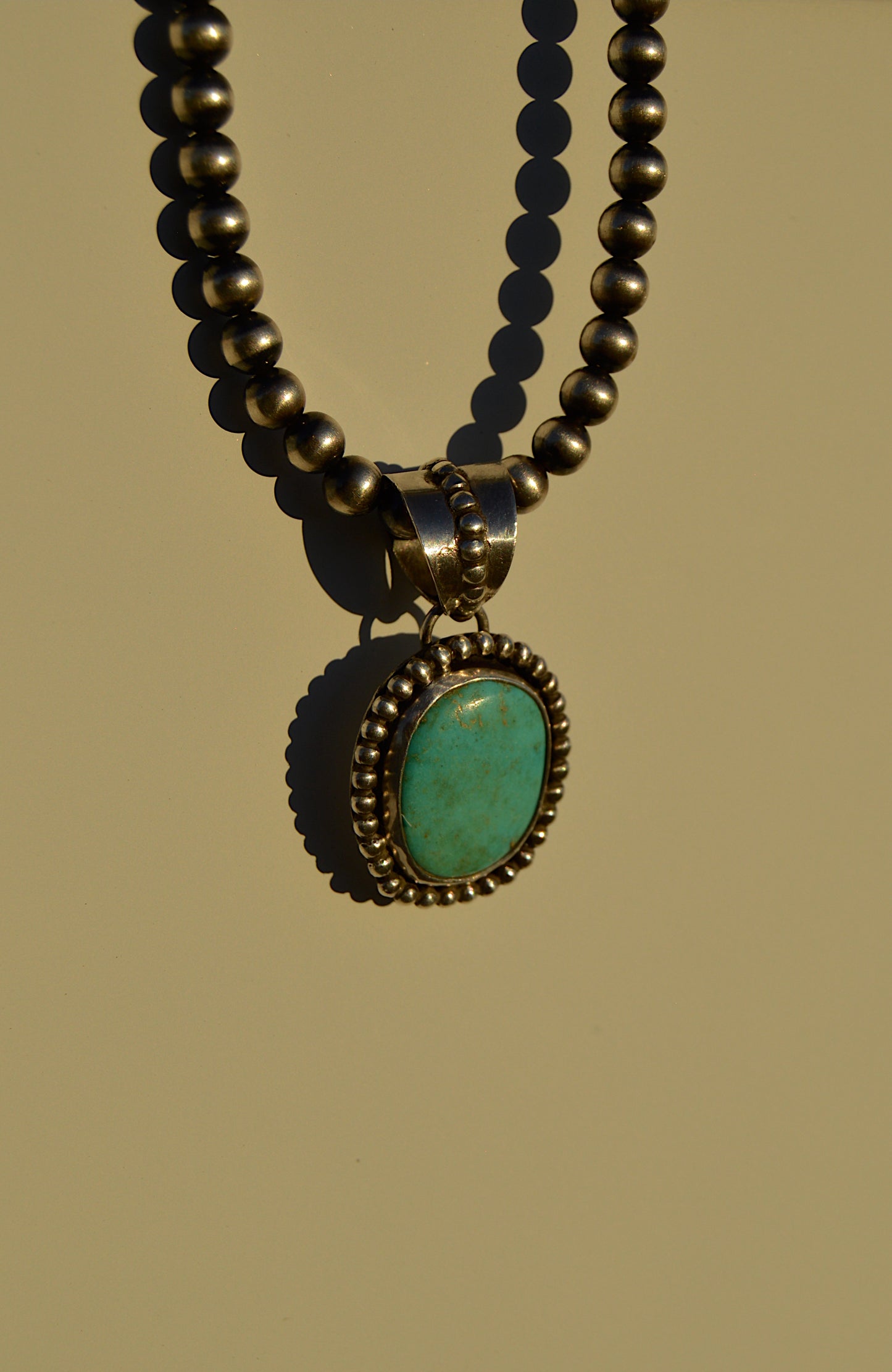 Beaded turquoise pendant